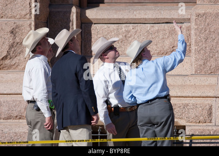 Texas Rangers gather evidence on the south steps of the Texas Capitol on Thursday after a man fired several shots on the grounds Stock Photo