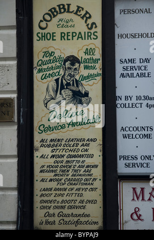 Board showing the services in a Cobblers Shop Whitehorse Street London W1 Stock Photo