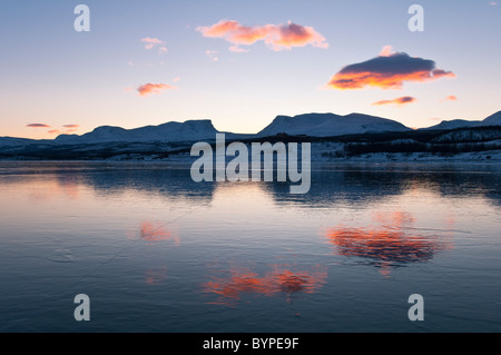 reflection of the famous 'lappenforte' Mountains in frozen lake Tornetraesk, Abisko, Lapland, Sweden Stock Photo
