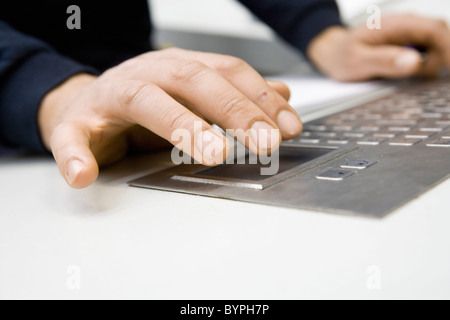 Hands using keyboard on control panel Stock Photo