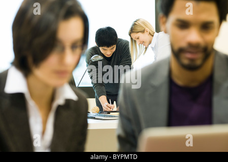 Colleagues working together on project Stock Photo