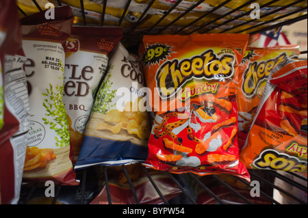 A display of tasty Frito-Lay brand chips, including Cheetos, in a supermarket in New York Stock Photo