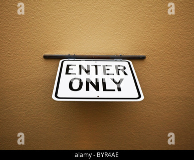 enter only sign mounted on ceiling Stock Photo