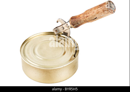 Old dirty tin can opener with wooden handle opening tin can with food on white background Stock Photo