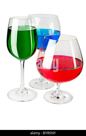 Red, green, blue colored liquid in wine and cognac glasses on white background. RGB color model imitating image Stock Photo