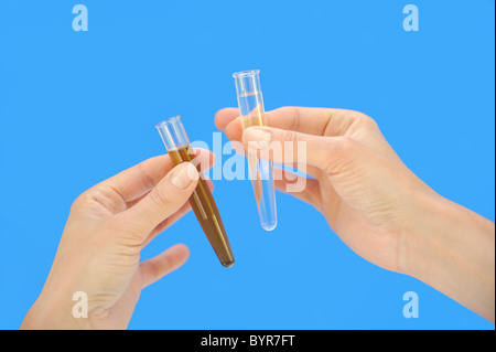 Clean and dirty water samples in test tube Stock Photo