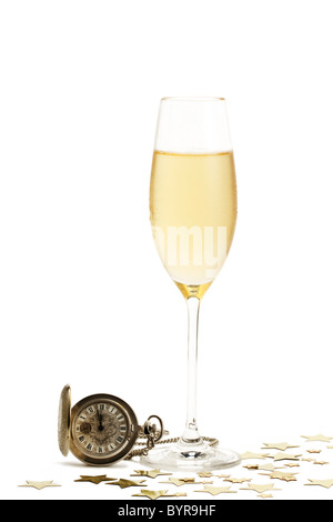 cold glass of champagne with a old pocket watch and metal stars on white background Stock Photo