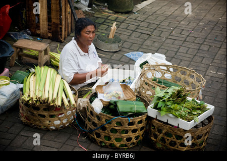 The public market in Ubud, Bali, is a colorful and busy place in the early morning when Balinese people come to buy food. Stock Photo