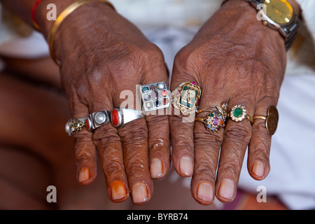 India, Rajasthan, Jodhpur close up of elderly man's hands and his rings Stock Photo