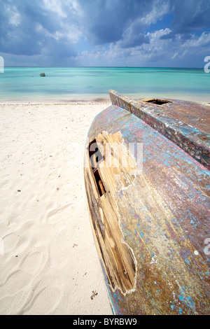 Shipwreck of a Wooden Boat on the Coastline of the Turquoise Water of the Caribbean Sea Stock Photo