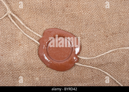 Wax seal on sackcloth material Stock Photo