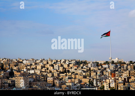 Large Jordanian flag flying over the city of Amman, Jordan Stock Photo