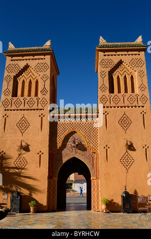 Traditional Berber pise towers made of red adobe and blue sky at desert resort Kasbah Morocco Stock Photo