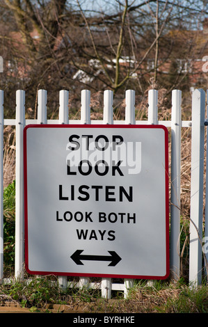 Stop Look Listen Look Both Ways Sign On an Unmanned Railway Crossing Stock Photo