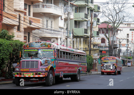 Panama,Latin,Central America,Panama City,Calidonia,neighborhood,street scene,traffic,lane,Diablo Rojo,bus,coach,custom paint job,electric transmission Stock Photo