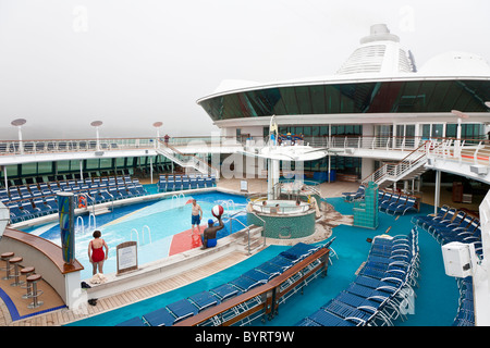 Almost empty deck of Royal Caribbean's Jewel of the Seas cruise ship on a day with heavy fog Stock Photo