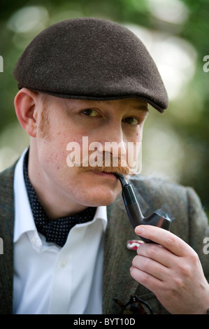 A man smokes a pipe at the Chap Olympiad in Bedford Square. Stock Photo