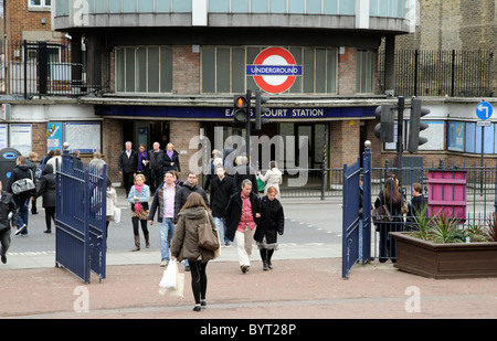 Passengers leaving Earls Court Underground Station on Warwick Road west London UK Stock Photo