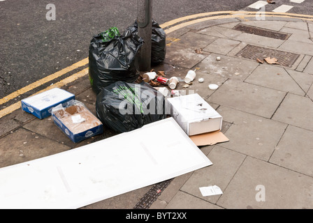 Rubbish left on the pavement of Denmark Street, London, WC2 Stock Photo