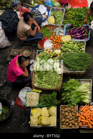 The public market in Ubud, Bali, is a colorful and busy place in the early morning when Balinese people come to buy food. Stock Photo