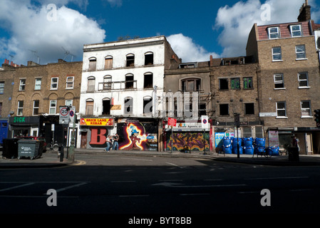 Derelict shops in Redchurch Street with graffiti by Ben Eine near Brick Lane East End, London England UK    KATHY DEWITT Stock Photo