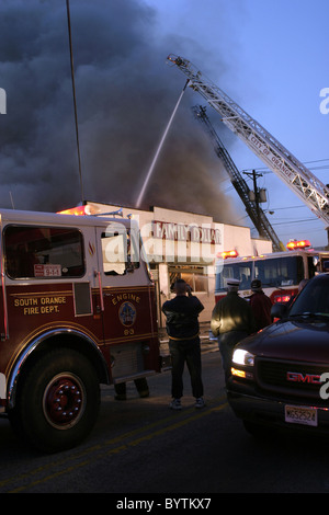 Daylight falls at scene of a large store fire in New Jersey Stock Photo