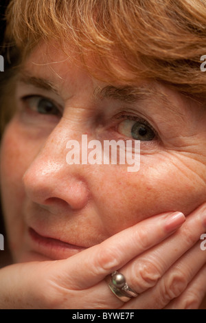 mature woman staring at camera. Stock Photo