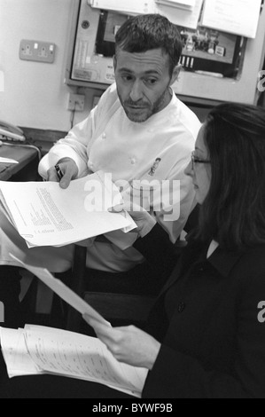 Chef Michel Roux jr at Le Gavroche with the accountant of the restaurant Stock Photo