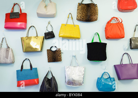 A wall of handbags at the Kate Spade pop-up store in Covent Garden, London, England Stock Photo
