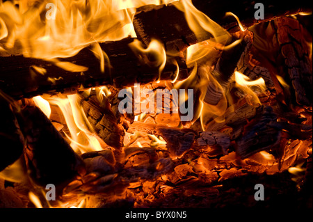 Close up of red hot embers in a wood fire at night, UK 2011 Stock Photo
