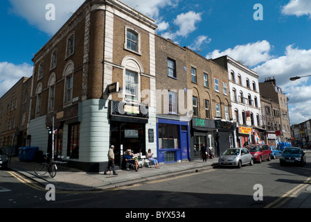 People drinking coffee sitting outside Franze & Evans cafe in Redchurch Street near Brick Lane, East End, London England UK   KATHY DEWITT Stock Photo