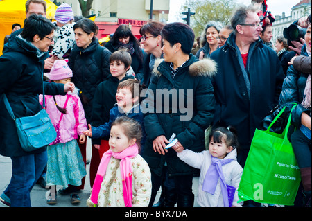 Paris, France, Street Scenes, Belleville District, Chinatown, Crowd of French Families Celebrating 'Chinese New Year' different cultures, mixed ethnicity friends outdoors city, multigenerational family, children immigration Stock Photo