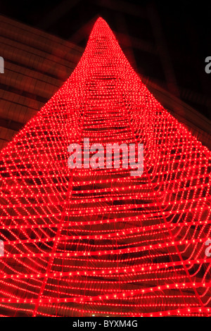 Christmas tree made of red lights in the city Stock Photo