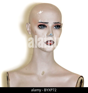 Weathered plastic mannequin doll head on white background. Stock Photo