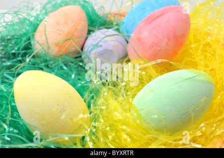 Colorful Easter eggs on bed of Easter grass. Stock Photo
