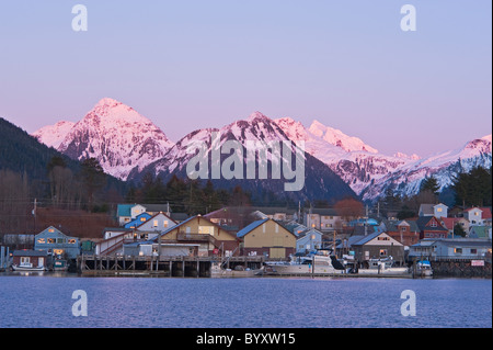 Channel, harbors and snow capped mountains in Sitka, Alaska during a beautiful sunset. Stock Photo