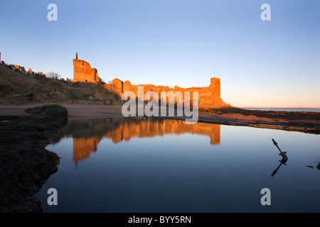 St Andrews Castle reflected in the Bathing Pond at Sunrise Fife Stock Photo