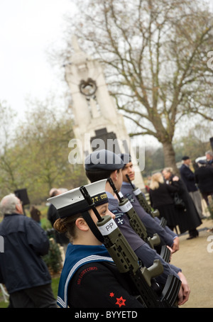 a female sea cadet stand guard at the Cenotaph during remembrance day , central park , east ham Stock Photo