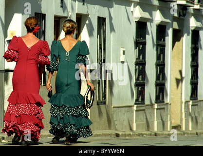 Two Spanish ladies in traditional dress during a village festival in Andalusian village of Alozaina. Stock Photo