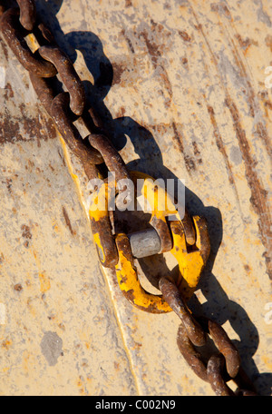 Two rusty metal chains connected together Stock Photo