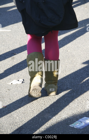 woman wearing ugs uggs boots in city town Stock Photo