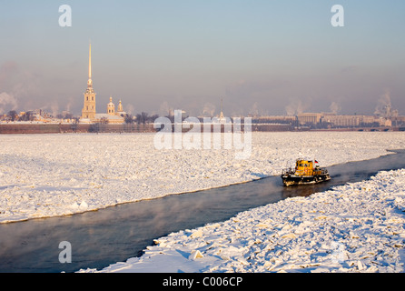 Ice breaker on frozen Neva river with Peter and Paul Fortress in background, St Petersburg Russia Stock Photo