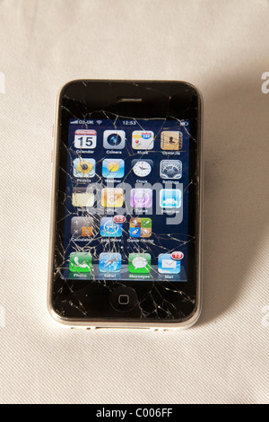 Screen broken and cracked on  iphone. Damaged mobile phone. 104005 Iphone Stock Photo