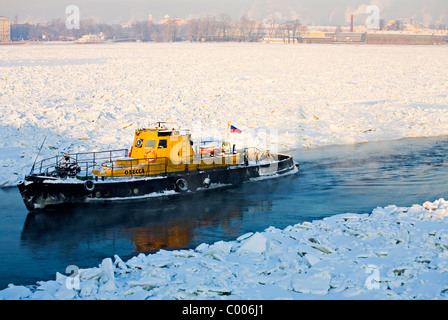 Ice breaker on frozen Neva river with Peter and Paul Fortress in background, St Petersburg Russia Stock Photo