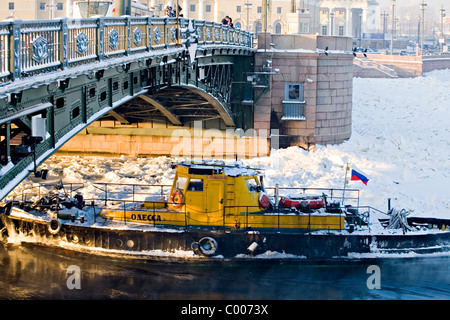 Ice breaker on frozen Neva river with Peter and Paul Fortress in background, St Petersburg Russia Stock Photo