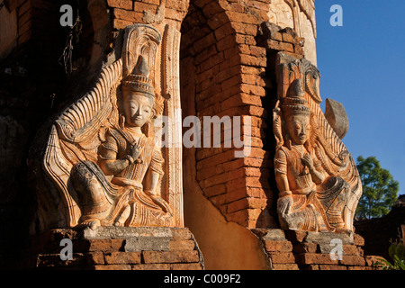 Reliefs on exterior of ruined pagoda, In Dein, Inle Lake, Myanmar (Burma) Stock Photo