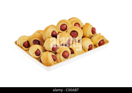 Pigs in a Blanket on serving tray on white background, cutout. Stock Photo