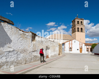 Pilgrim entering rural village while walking from Madrid to Santiago de Compostella, Spain. Stock Photo