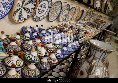 Brightly colored tagine bowls and plates in a ceramic shop in Fes el Bali Medina Morocco Stock Photo