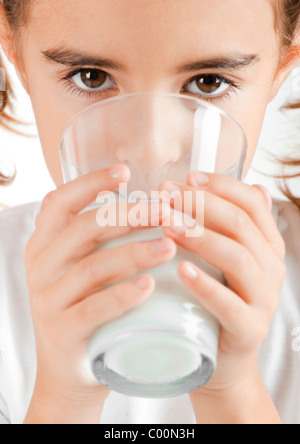 Portrait of a little girl drinking a cup of milk Stock Photo